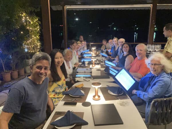 travelers sharing meal in Palau at family table